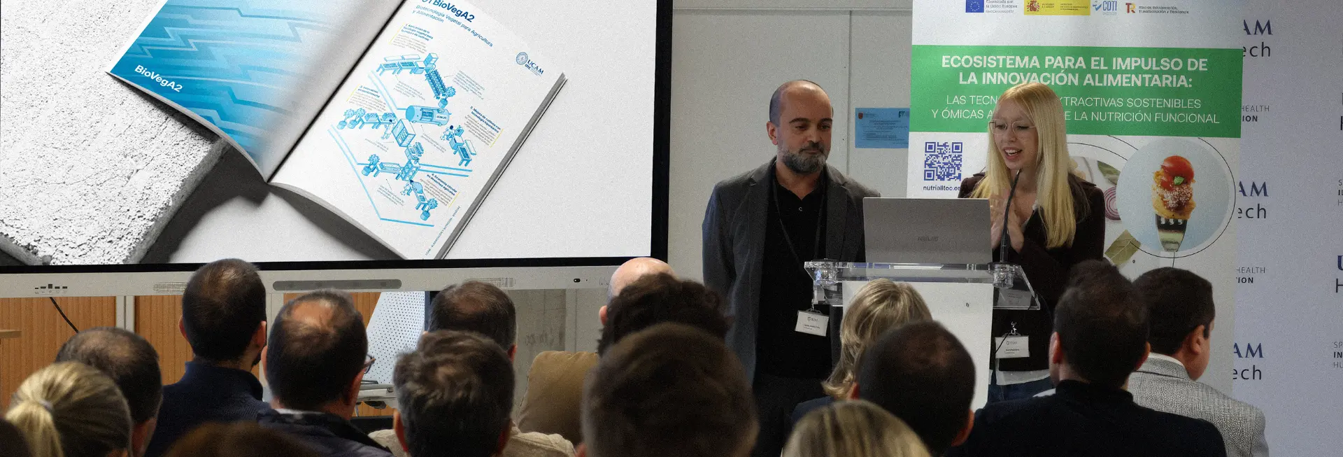 Presentación en un congreso científico ante público universitario